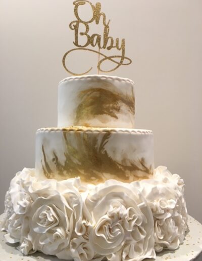 Fabulous baby shower cake in edible gold - The Artful Baker