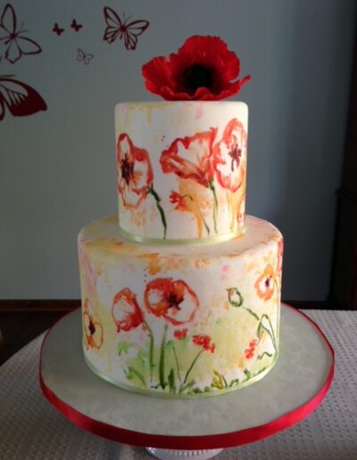 Watercolored poppy cake with sugar flower -The Artful Baker